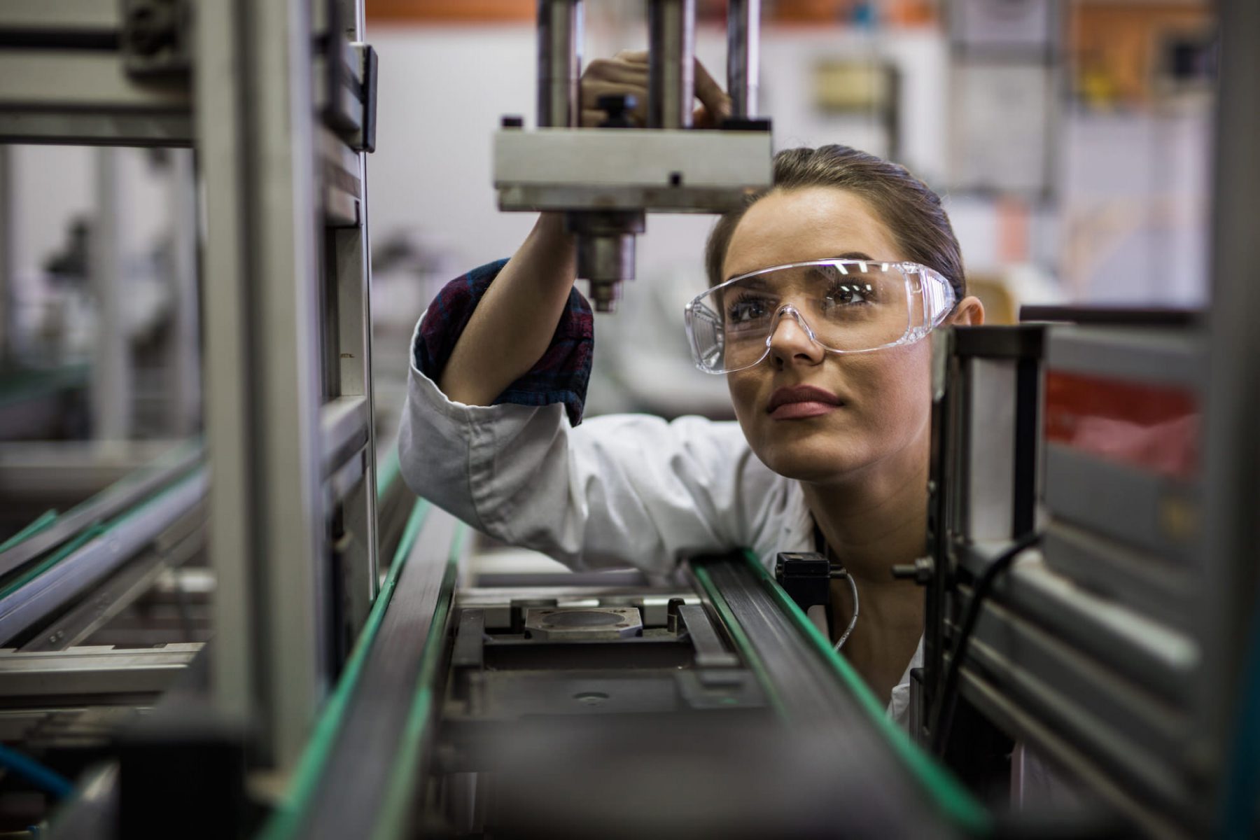 Image of a woman working in a laboratory wearing protective eyewear